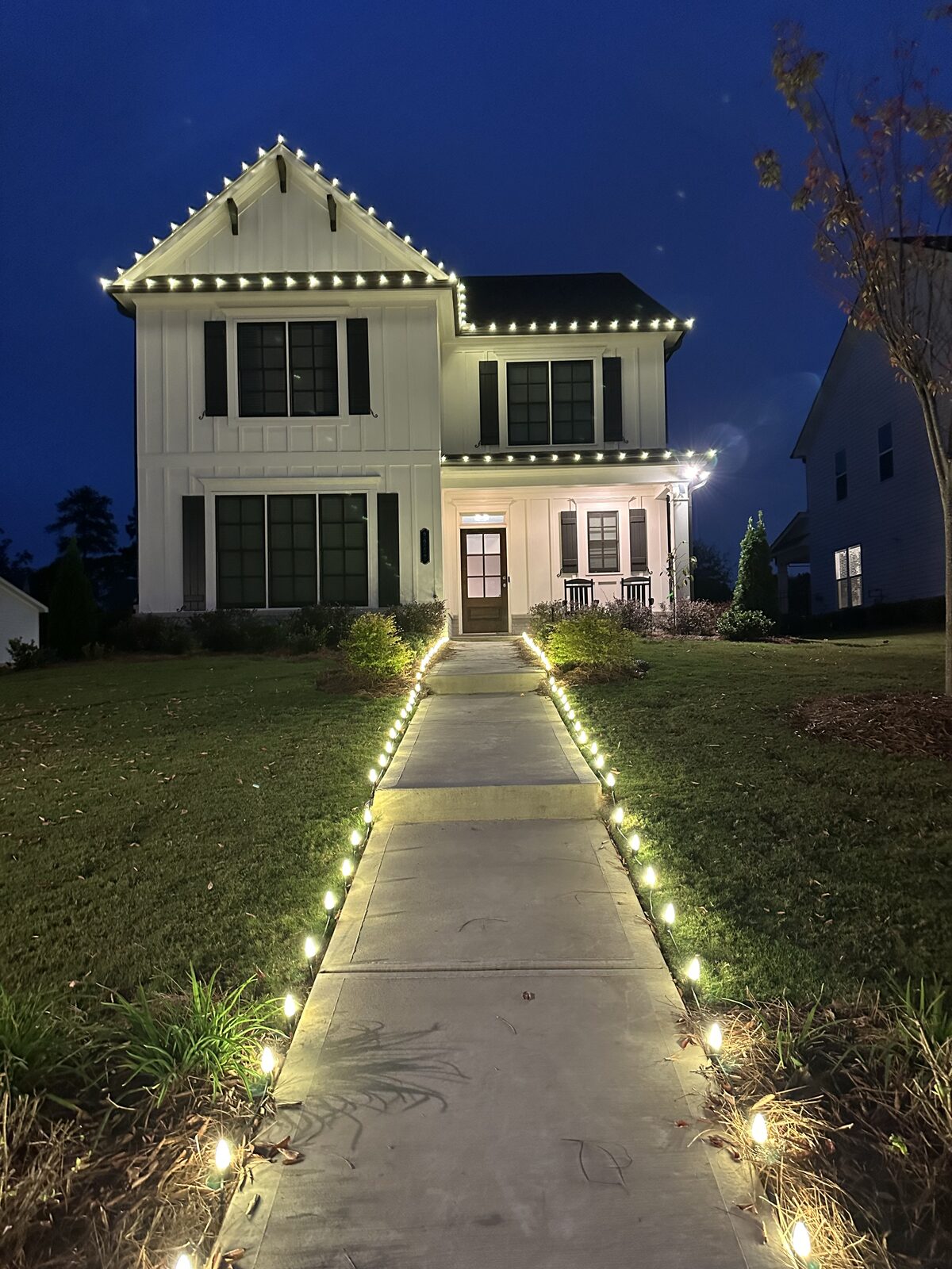 Crew installed roofline lights on a large home