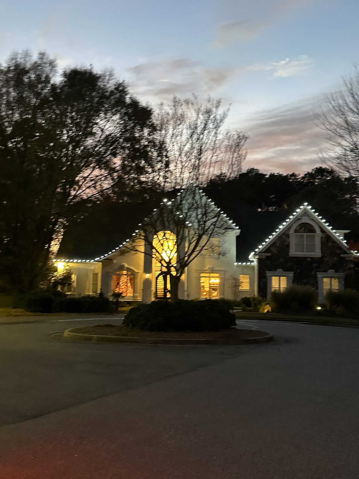 Two-story home with full roofline lighting