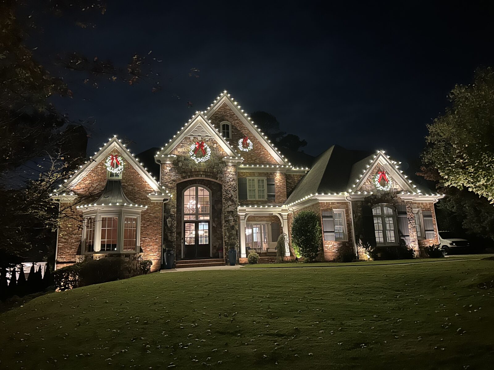 Home with warm lighting across every peak